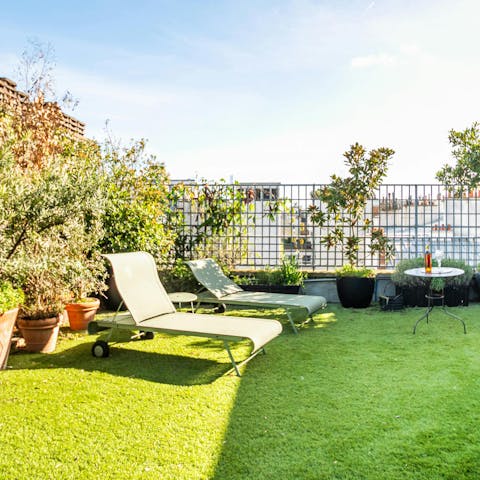 Relax on the private terrace, a glass of wine in hand