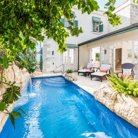 Relax with a swim in the private pool, complete with soothing waterfall