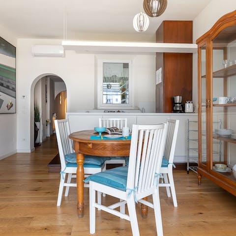 Set the table as dinner cooks away in the tidy kitchenette