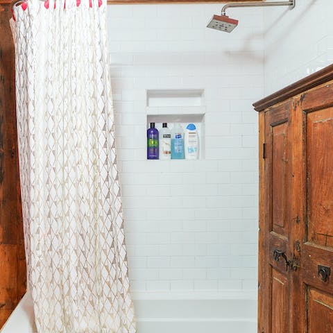 Relax and unwind after a day of exploring the city in the bathtub