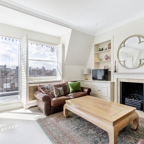 Kick back in the bright living room with a glass of wine