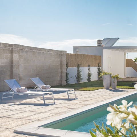 Spend endless afternoons relaxing on loungers by the pool