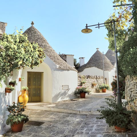 Marvel at the cone-shaped trulli houses that make Alberobello such a must-see destination, twenty-five minutes away