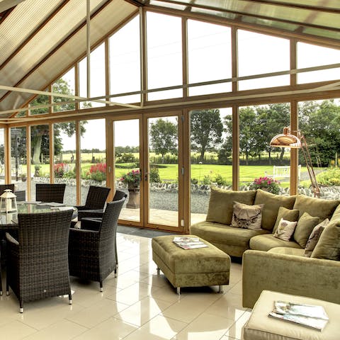 Kick back with a book in the fabulous conservatory