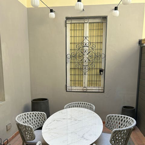 Spend the evening in the courtyard with its festoon lights drinking a glass of Prosecco