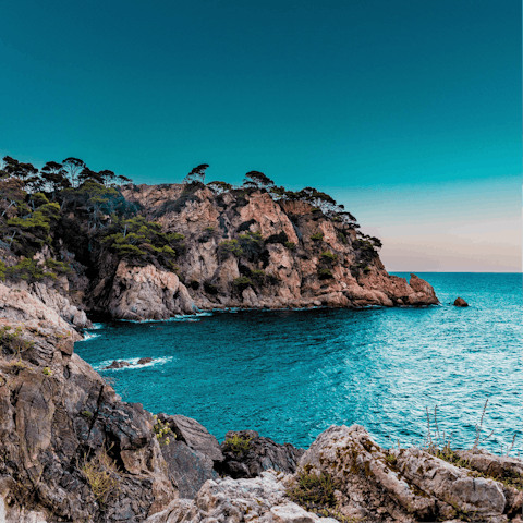 Spend mornings relaxing on Cabopino Beach, a twenty-minute walk away