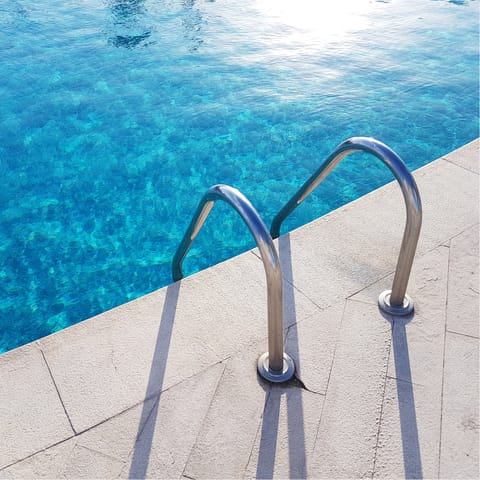 Cool off on hot afternoons in the communal outdoor pool