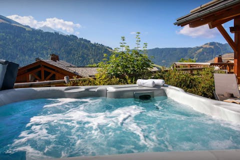 Soothe tired muscles in the private hot tub after a day of skiing