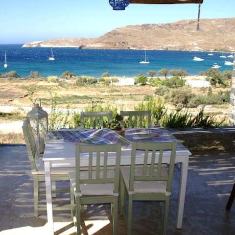 Enjoy some karpouzopita (a sweet pie made from watermelon, local thyme honey and cinnamon) at your outdoor dining table