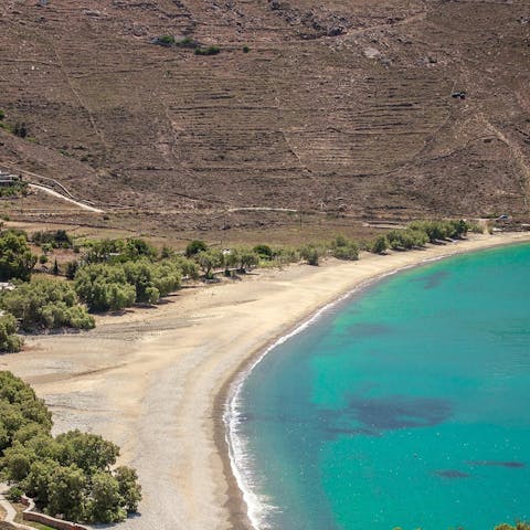 Relax on the long sandy beach of Ganema, a three-minute stroll away