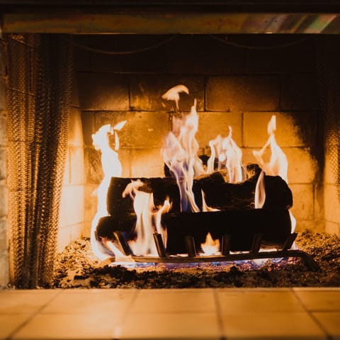 Cosy up by the fireplace for evenings in