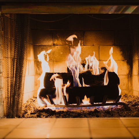 Cosy up by the fireplace for evenings in