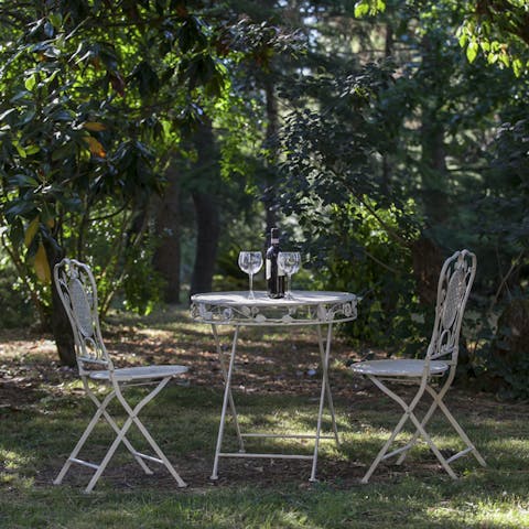 Savour a glass of wine amidst the picturesque gardens