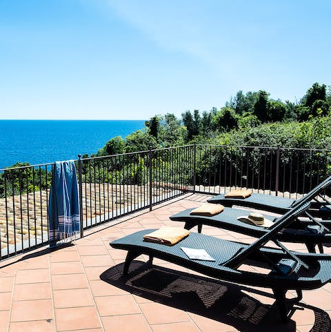 Soak up the sun on the loungers as you admire the sea views