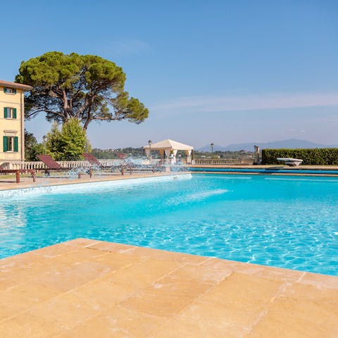 Lounge by the pool underneath the Mediterranean sun