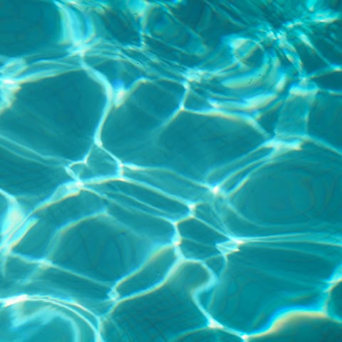 Enjoy a refreshing swim in the shared rooftop pool