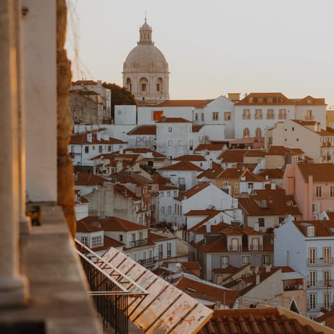 Rise early for stunning sunrise light over the city rooftops – Miradouro de Santa Luzia is a seven-minute walk away