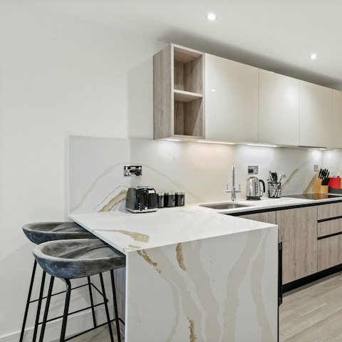 Perch by the sleek breakfast bar and sip your morning coffee