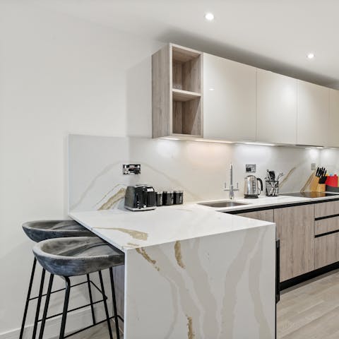 Perch by the sleek breakfast bar and sip your morning coffee