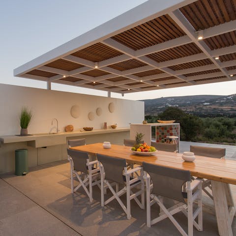 Watch the sky turn pink and share a beautiful Greek meal in the outdoor dining area