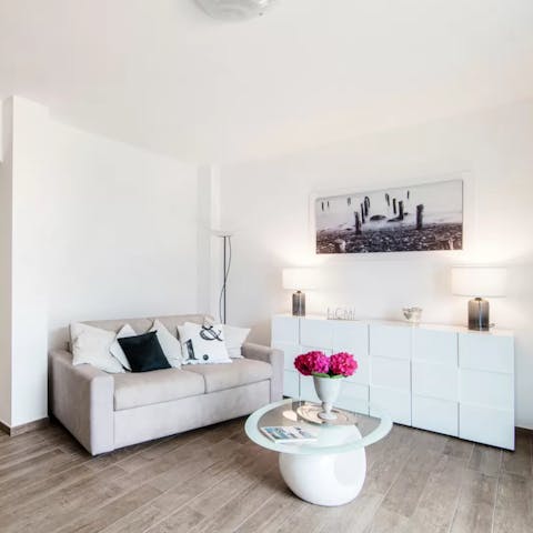 Put your feet up in the pristine living space at the end of a busy day