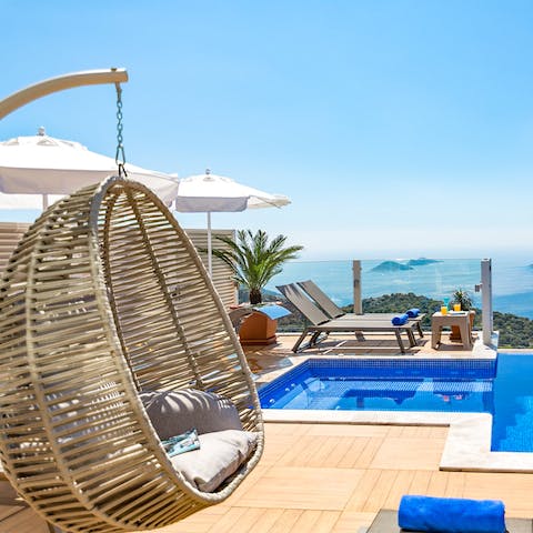 Sit in the swinging chair with a book and something cold to drink