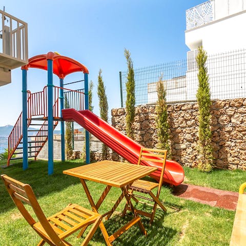 Play with the kids on the slides and play equipment