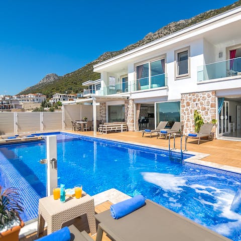 Swim in the infinity pool or relax in the built-in jacuzzi