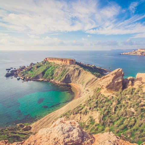 Make a beeline for the sandy shore and dip your toes in the crystal clear waters