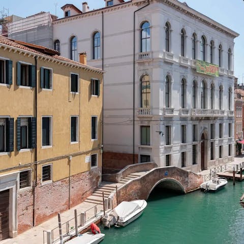 Watch gondolas drift by from the apartment's windows