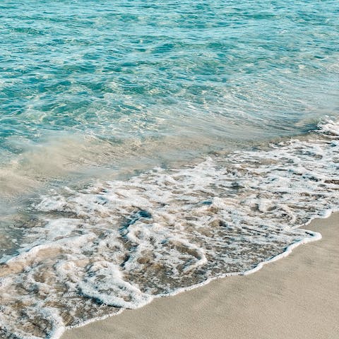 Drive or catch the tram to Puerto de Sóller to visit sandy shores
