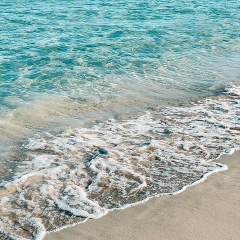 Drive or catch the tram to Puerto de Sóller to visit sandy shores