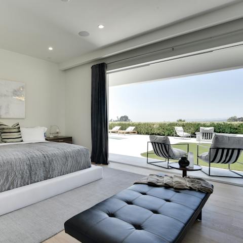 Throw open the huge doors and savour a cool breeze from the comfort of your bed