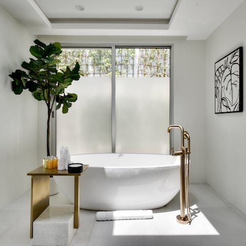 Treat yourself to an indulgent bubble bath in the freestanding tub