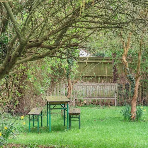 Relax in the lush gardens and admire the countryside view