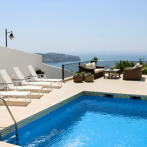 Gaze out at the ocean from the private pool