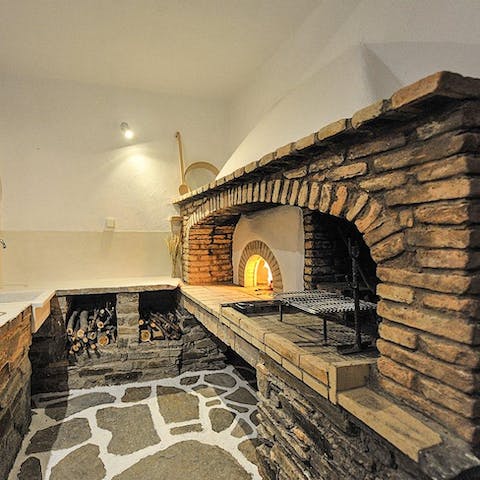 Cook group dinners on the wood-fired outdoor oven