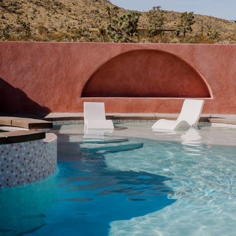 Cool off in the private pool, surrounded by desert landscape