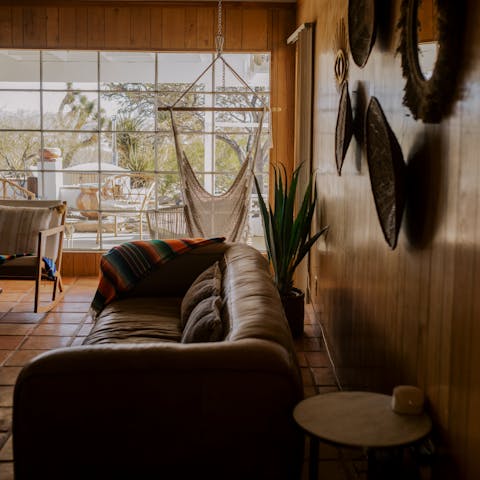 Listen to a record while relaxing in the rustic living area