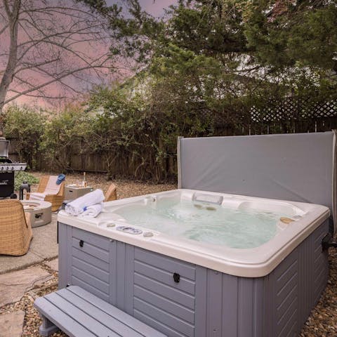 Relax and unwind in the hot tub in the garden