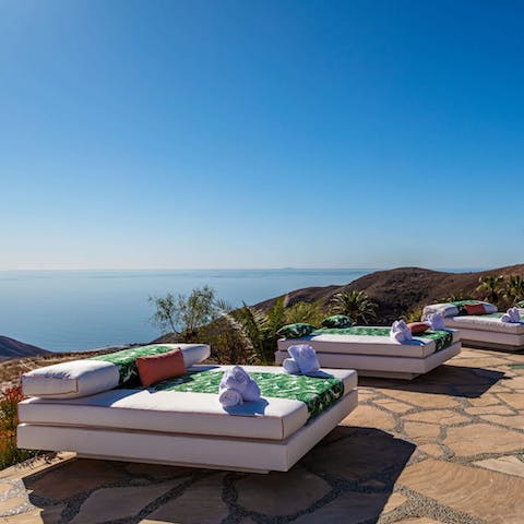 Lounge back on one of the daybeds and drink in the view of the Pacific Ocean
