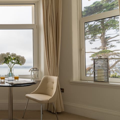 Enjoy brunch with a gorgeous view of leafy trees and rolling waves