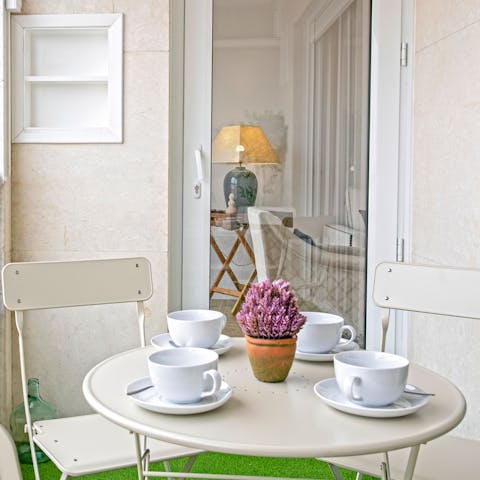 Enjoy a bite to eat on the balcony as the sun begins to set
