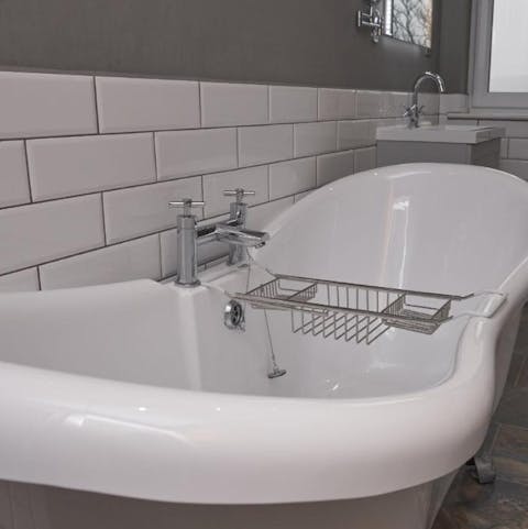 Warm up after a bout of wild swimming in the freestanding bathtub