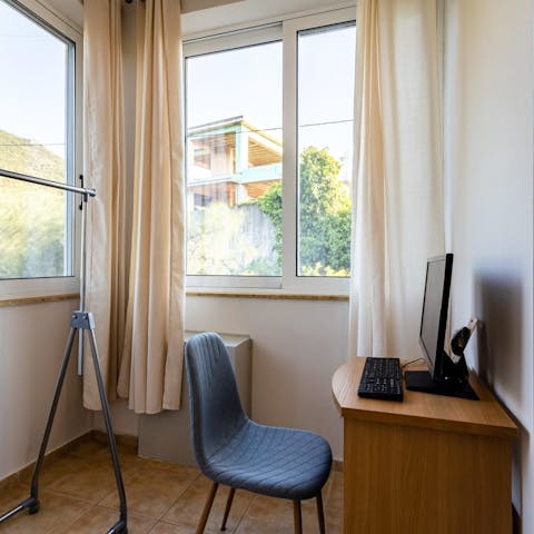 Close the door behind you and lighten your workload in this well-lit home office