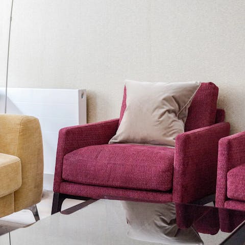 Curl up with an engrossing read in the cushy armchair