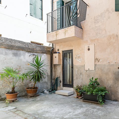 Get some fresh air in the plant-filled courtyard