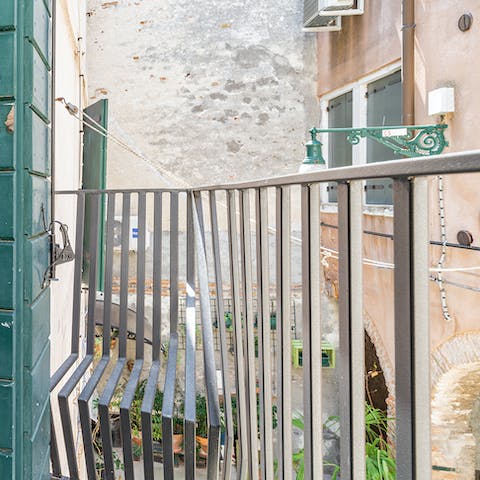 Look out into the courtyard, seated in the custom-built balcony seat – a signature feature