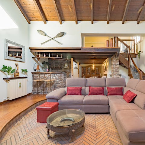 Serve drinks from the bar or chill in the conversation pit