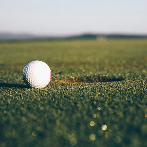 Tee off The Els Club At Dubai Sport City golf course, just ten minutes away by car